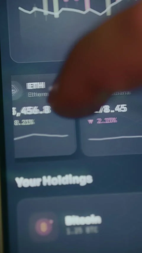 User analyzing various digital currencies and real-time market trends Video stock 333839006
