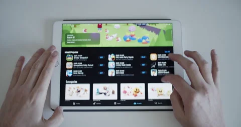 User browsing Apple Arcade subscription gaming platform on App Store Stock Footage 151266049