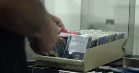 User browsing vintage computer floppy disks Stock Footage 148787584