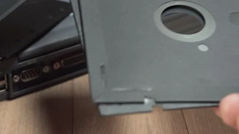 User browsing vintage computer large floppy disks. Stock Footage 149424006