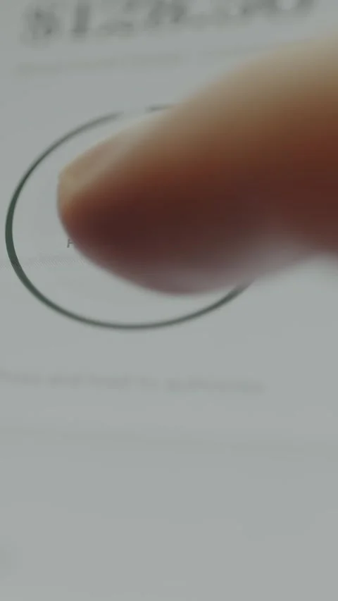 User completing a payment via a Hold to Pay action button Stock Footage 332510442