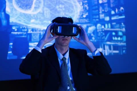 User engages with virtual reality technology in a professional setting duri.. Stock Photos