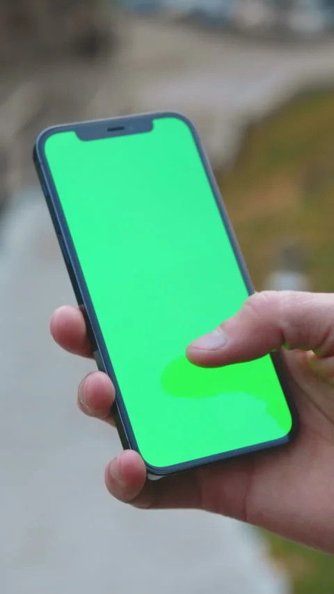 User engaging with mobile application through swipe gestures amidst lively urban Stock Footage 336089099