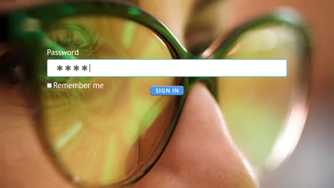 User enters password on a login page with background image of a woman's eyes Stock Footage 346710946