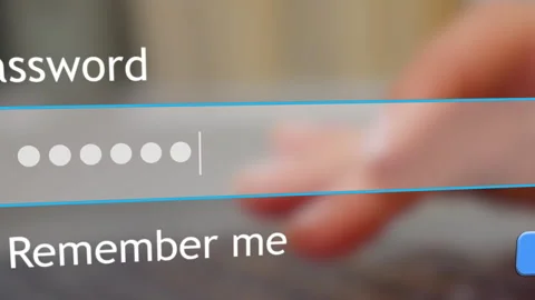 User enters password in a web form while someone watches the screen Stock Footage 334022250