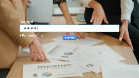 User enters password in website form at office desk with employees visible Stock Footage 346710204