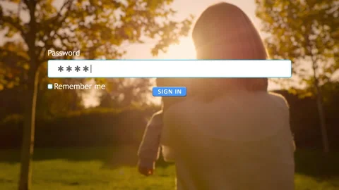 User enters password on a website while holding child in a garden Stock Footage 346710610