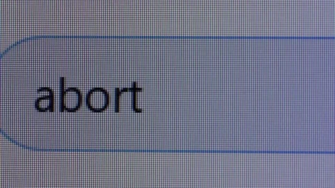 User enters text query for word Abort in search bar form of internet browser on Video stock 219611961