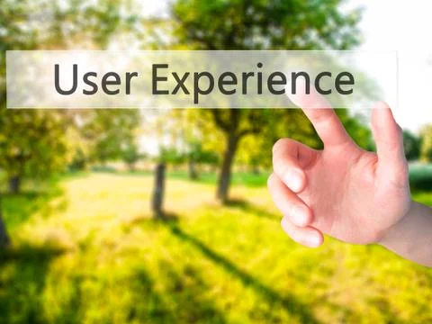 User Experience - Hand pressing a button on blurred background concept on vis Stock Photos