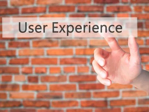 User Experience - Hand pressing a button on blurred background c Stock Photos