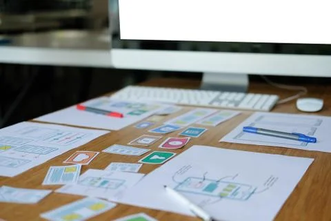 User experience UX designer designing web on smart phone layout. UI developer Stock Photos