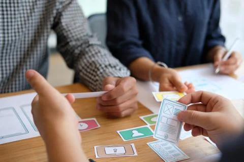 User experience UX designer designing web on smart phone layout. UI developer Stock Photos