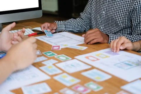 User experience UX designer designing web on smart phone layout. UI developer 写真素材