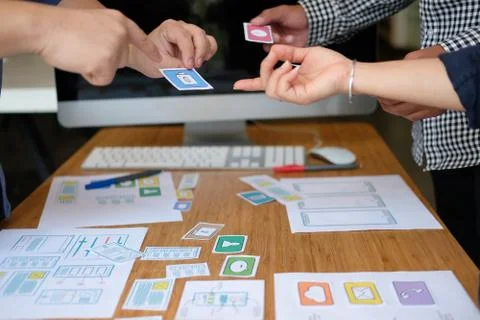 User experience UX designer designing web on smart phone layout. UI developer Foto stock
