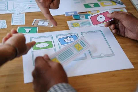 User experience UX designer designing web on smart phone layout. UI developer Stock Photos