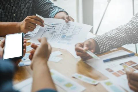 User experience UX designer designing web on smart phone layout. UI developer 写真素材