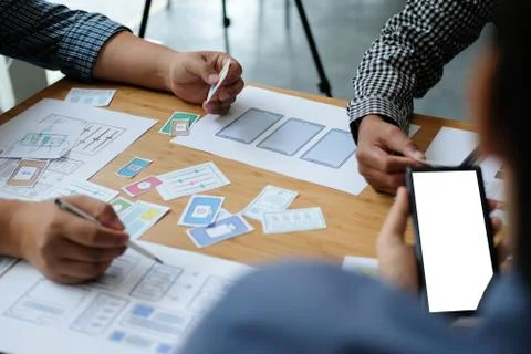 User experience UX designer designing web on smart phone layout. UI developer Foto stock