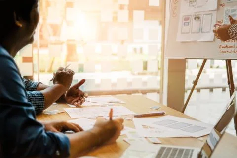 User experience UX designer designing web on smart phone layout. UI developer Stock Photos