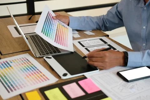 User experience UX designer designing web on smart phone layout. UI developer 스톡 사진