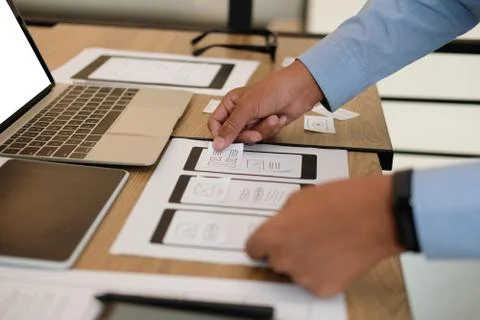 User experience UX designer designing web on smart phone layout. UI developer 写真素材