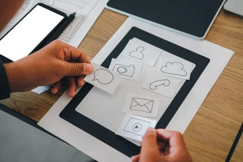 User experience UX designer designing web on smart phone layout. UI developer Foto stock