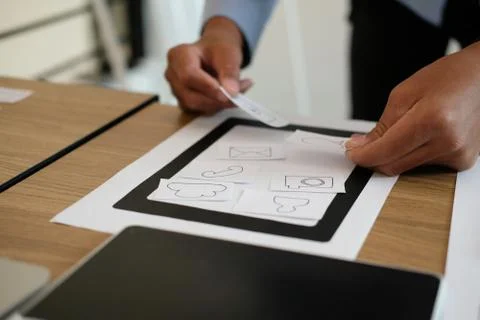 User experience UX designer designing web on smart phone layout. UI developer Foto stock