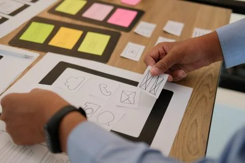 User experience UX designer designing web on smart phone layout. UI developer 写真素材