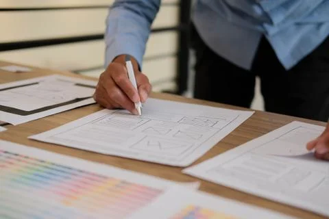 User experience UX designer designing web on smart phone layout. UI developer Foto stock