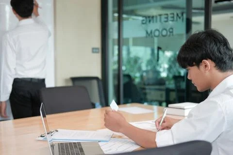 User experience UX designer designing web on smart phone layout. UI developer Stock Photos
