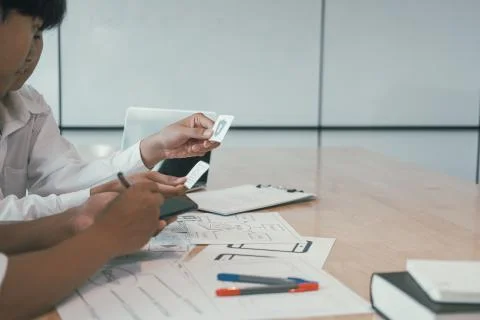 User experience UX designer designing web on smart phone layout. UI developer 写真素材