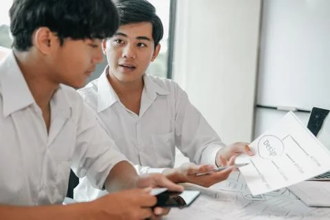 User experience UX designer designing web on smart phone layout. UI developer Stock Photos