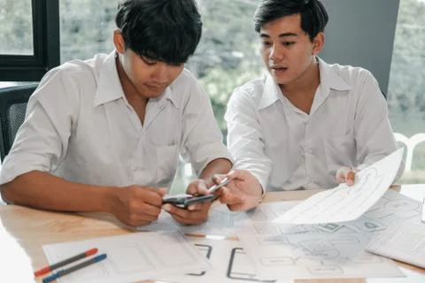 User experience UX designer designing web on smart phone layout. UI developer Stock Photos
