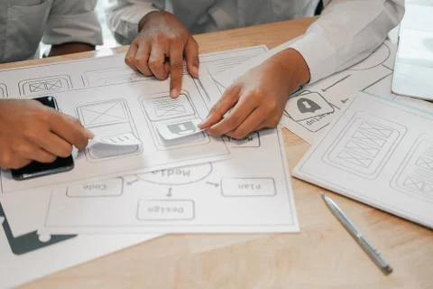 User experience UX designer designing web on smart phone layout. UI developer Foto stock