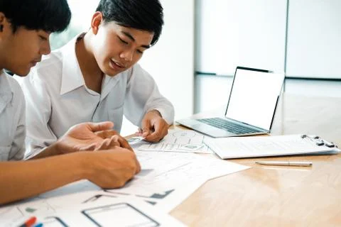 User experience UX designer designing web on smart phone layout. UI developer Stock Photos