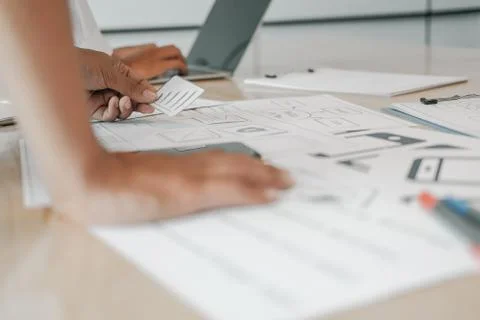 User experience UX designer designing web on smart phone layout. UI developer 스톡 사진