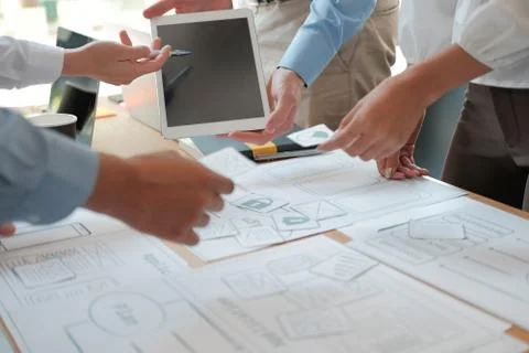 User experience UX designer designing web on smart phone layout. UI developer Stockfoto's