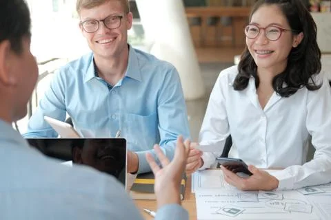 User experience UX designer designing web on smart phone layout. UI developer Stock Photos