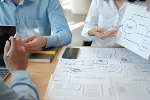 User experience UX designer designing web on smart phone layout. UI developer Stockfoto's