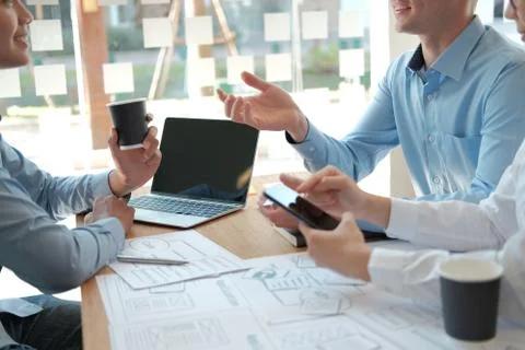User experience UX designer designing web on smart phone layout. UI developer Stock Photos