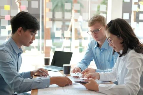 User experience UX designer designing web on smart phone layout. UI developer Stock Photos