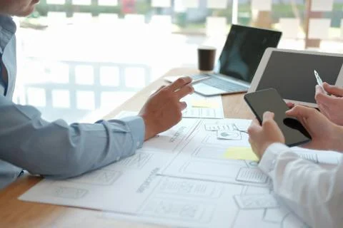 User experience UX designer designing web on smart phone layout. UI developer Foto stock