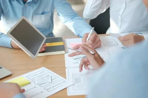 User experience UX designer designing web on smart phone layout. UI developer Foto stock