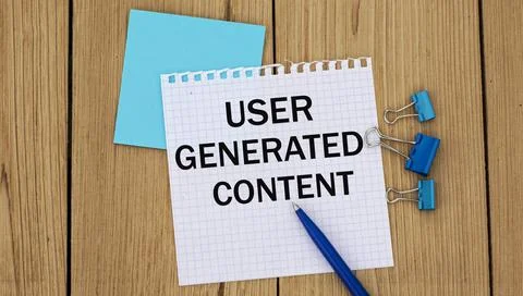 USER GENERATED CONTENT - word written in a notebook on a wooden background wi Stock Photos