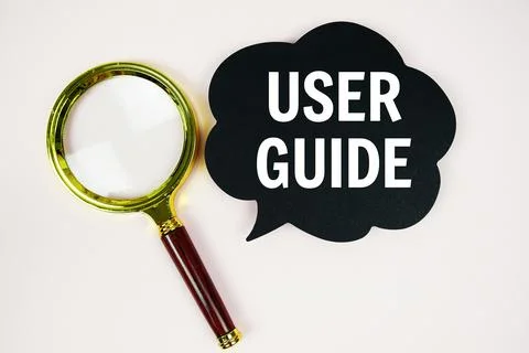 User Guide text with speech bubble and magnifying glass on pink background Stock Photos