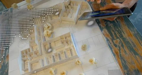 User hands placing tablet initiating code and map overlay, rotating 3D plan and Stock Footage 317407425