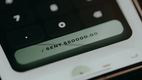 User initiates a money transfer, message shows a transfer of 50k Stock Footage 331172047