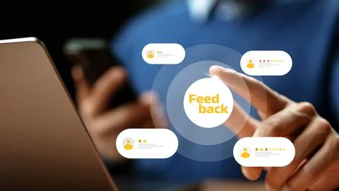 User interacting with feedback system on a laptop and smartphone Stock Photos