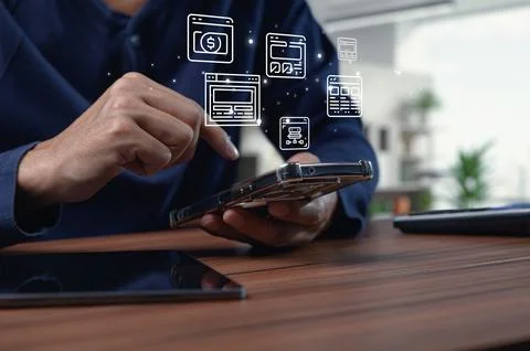 User interacting with mobile device featuring browser interface icons Stock Photos