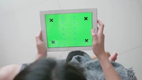 User Interacting with Tablet on a Light Background Stock Footage 314570661