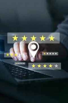 User interacts with feedback rating system on laptop 写真素材